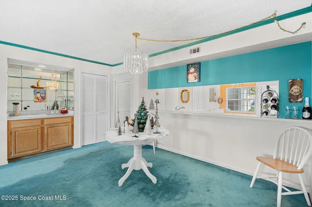 a view of a room with window and furniture