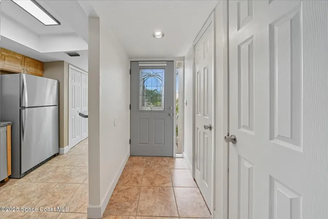 a view of a hallway with a bathroom