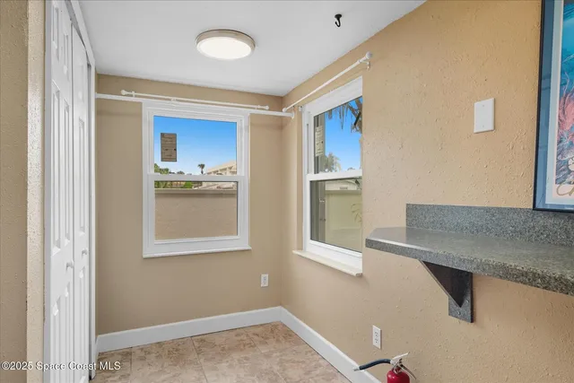 a view of a hallway with a kitchen
