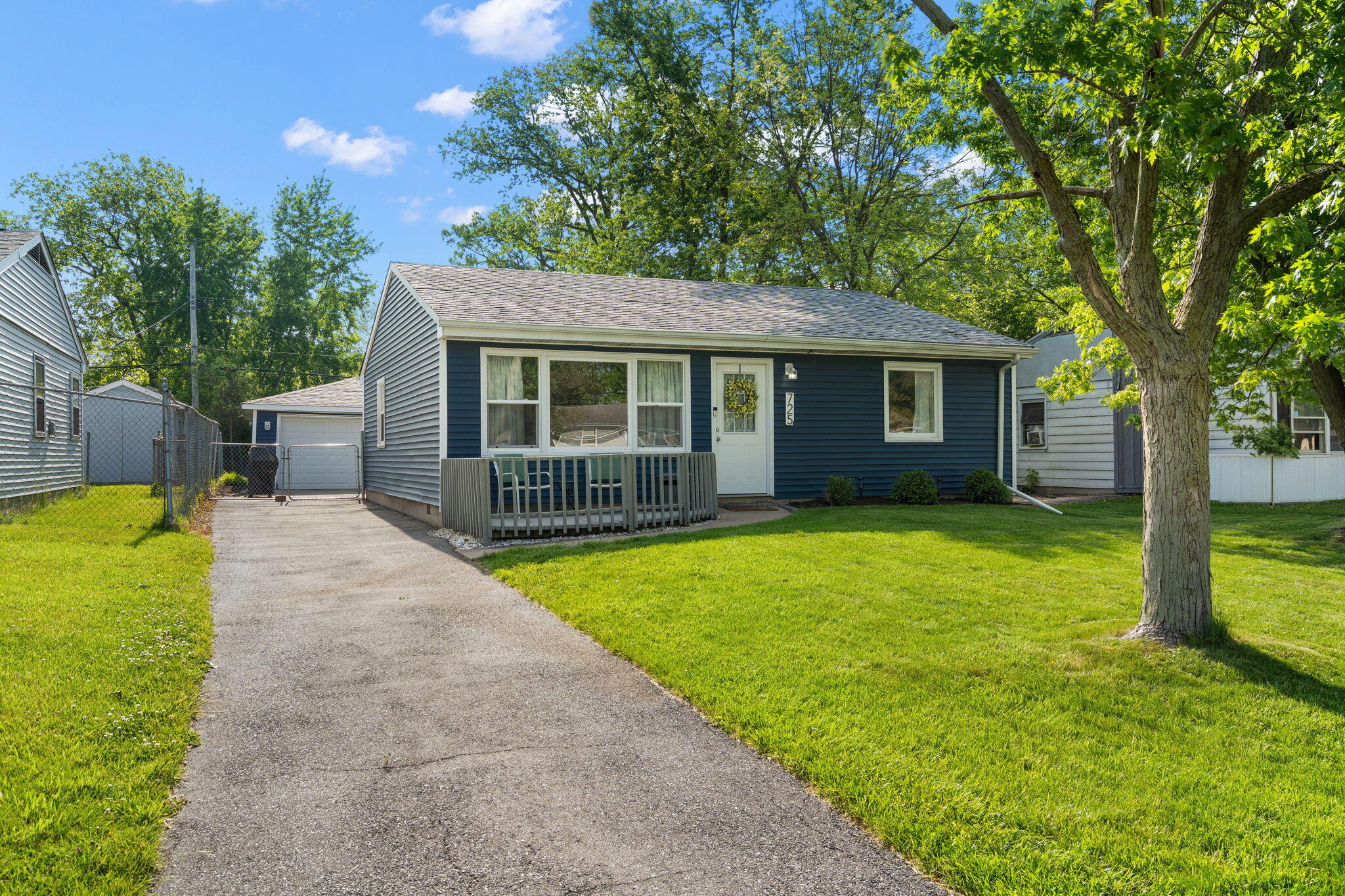 725 Juniper Road Valparaiso, IN 46385 - Photo 17 of 21 a view of a house with a backyard and a tree