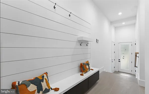 a bathroom with a shower sink and mirror