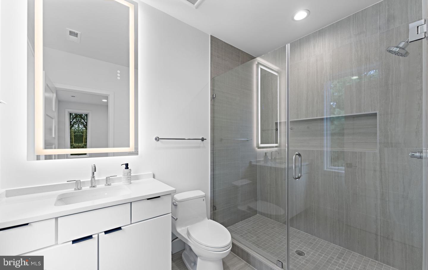 6330 Cross Street McLean, VA 22101 - Photo 18 of 19 a bathroom with a sink toilet and shower