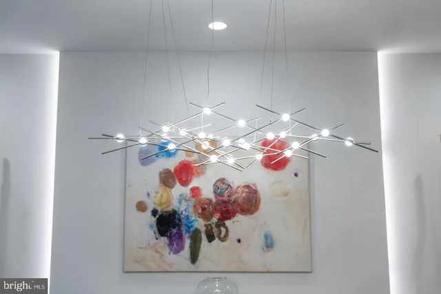 a kitchen with sink stove and living room