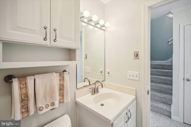 a bathroom with a sink a mirror and a shower