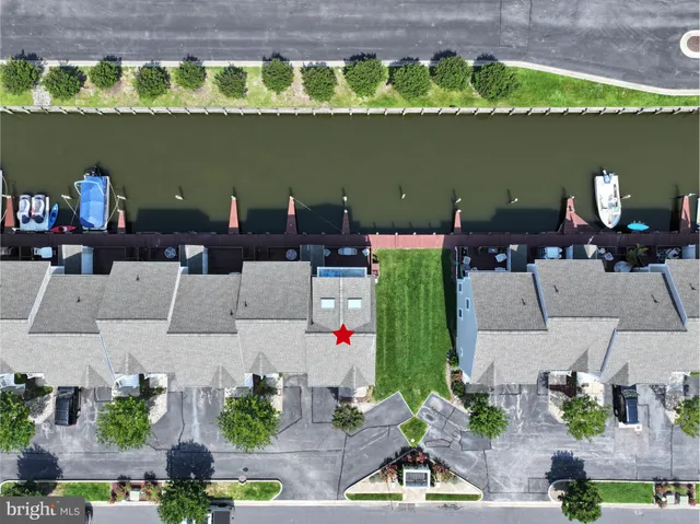 an aerial view of a house with outdoor space