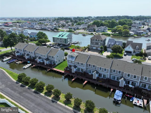 an aerial view of a house with a lake view