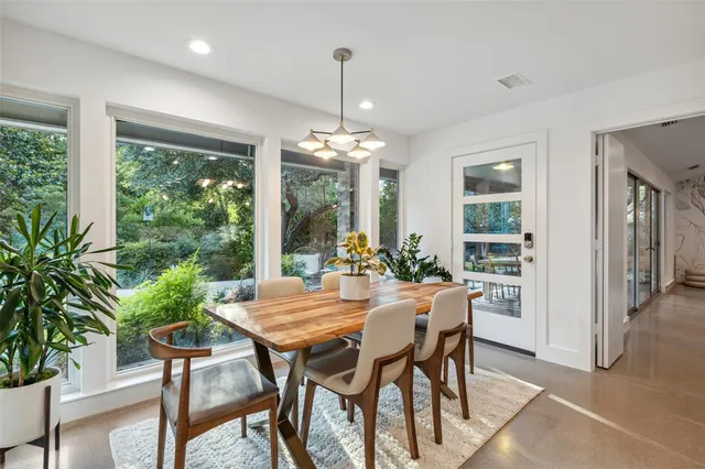a view of a dining room with furniture window and outside view