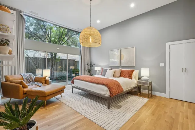 a bed room with a bed and a chandelier