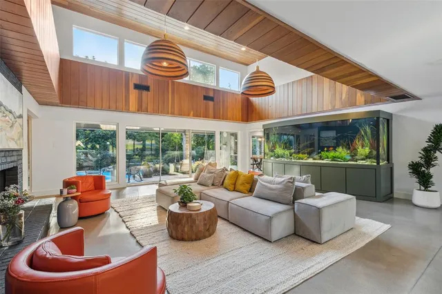 a view of a patio with couches chairs and a potted plant