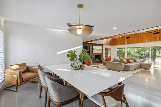 a view of a dining room with furniture window and outside view
