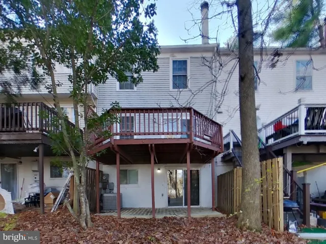 a view of a brick house with many windows
