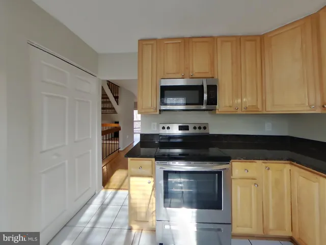 a kitchen with a stove and a microwave