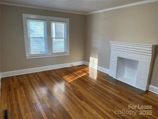 a view of front door with wooden floor