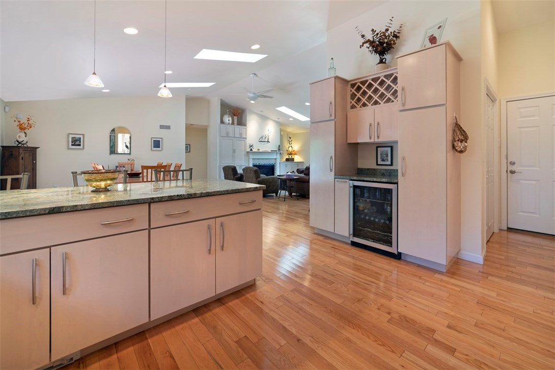 60 Walsh Road Charlestown, RI 02813 - Photo 27 of 27 open floor plan, kitchen with wine fridge, gleaming hardwoods, recessed lighting