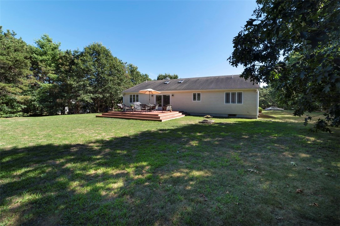 60 Walsh Road Charlestown, RI 02813 - Photo 2 of 27 Backyard with spacious deck