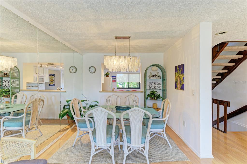 6840 Midnight Pass Road, Unit 6840 Sarasota, FL 34242 - Photo 12 of 66 a view of a dining room with furniture