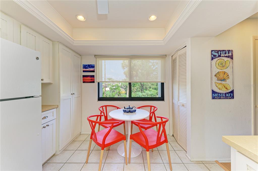 6840 Midnight Pass Road, Unit 6840 Sarasota, FL 34242 - Photo 20 of 66 a room with stainless steel appliances a rug and a window