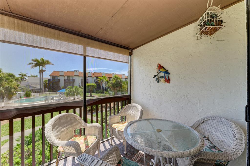 6840 Midnight Pass Road, Unit 6840 Sarasota, FL 34242 - Photo 24 of 66 a view of a dining room with furniture window and outside view