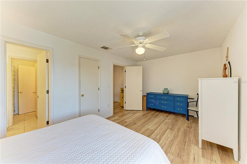 6840 Midnight Pass Road, Unit 6840 Sarasota, FL 34242 - Photo 37 of 66 a bedroom with a bed dresser and a window