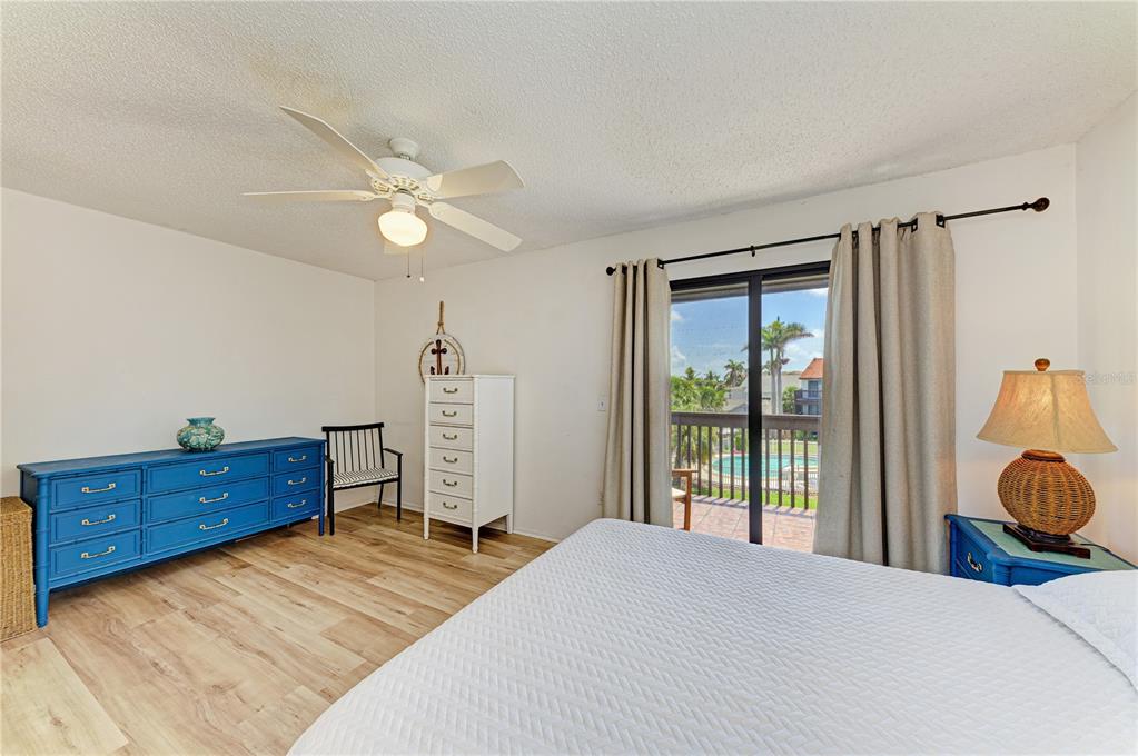 6840 Midnight Pass Road, Unit 6840 Sarasota, FL 34242 - Photo 38 of 66 a bed room with a bed and a window