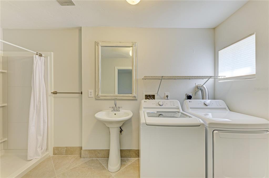 6840 Midnight Pass Road, Unit 6840 Sarasota, FL 34242 - Photo 53 of 66 a utility room with dryer and washer