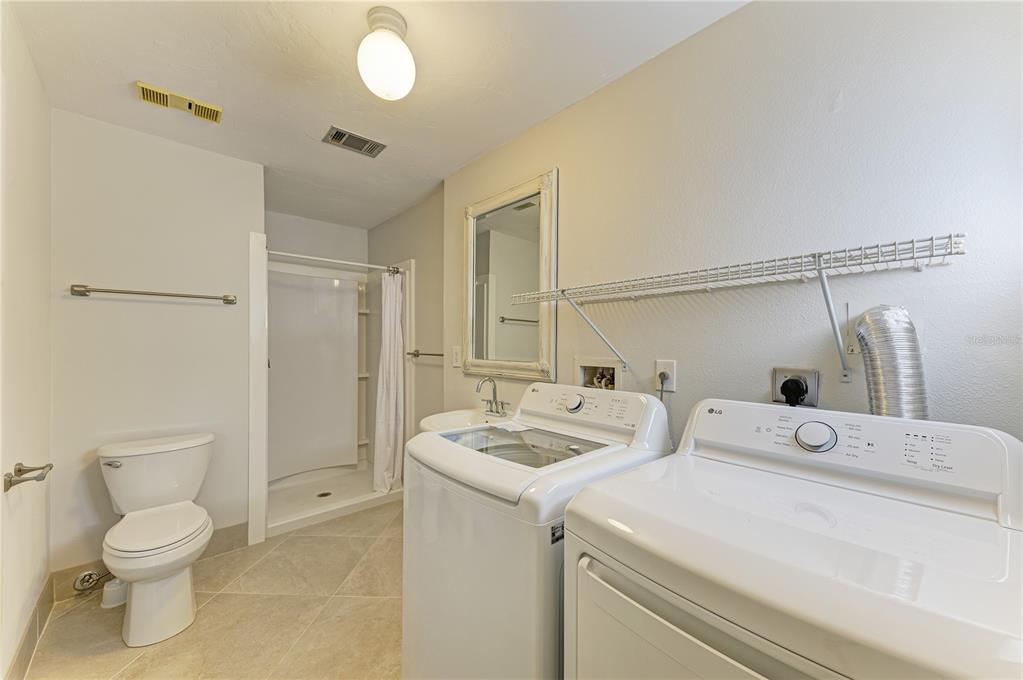 6840 Midnight Pass Road, Unit 6840 Sarasota, FL 34242 - Photo 55 of 66 a bathroom with a sink and a toilet