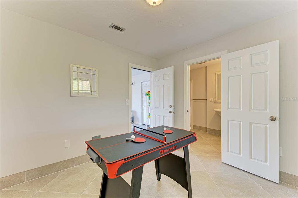 6840 Midnight Pass Road, Unit 6840 Sarasota, FL 34242 - Photo 58 of 66 a room with furniture and window