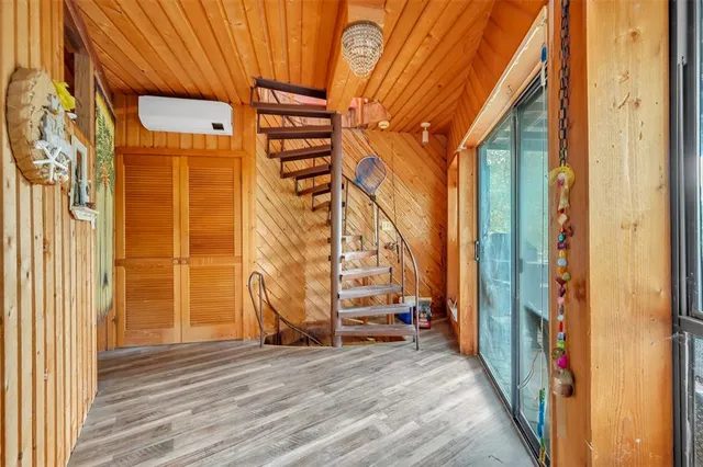 a view of an entryway with wooden floor