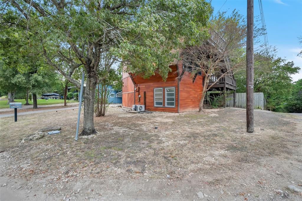 159 Catfish Trail Whitney, TX 76692 - Photo 2 of 36 a view of a house with a tree