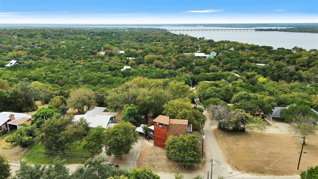 159 Catfish Trail Whitney, TX 76692 - Photo 27 of 36 an aerial view of residential houses with outdoor space and trees