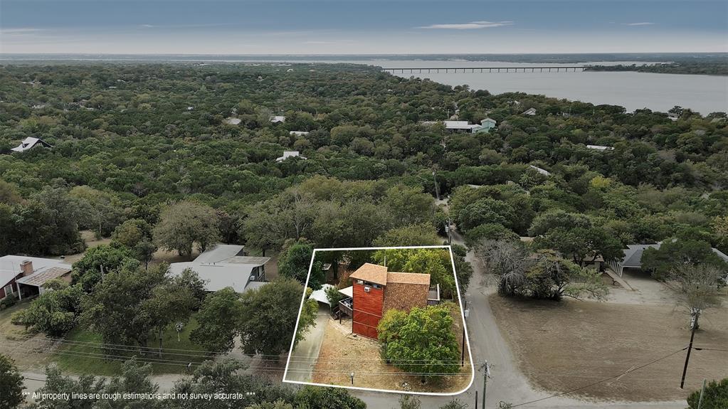 159 Catfish Trail Whitney, TX 76692 - Photo 28 of 36 an aerial view of house with yard and mountain view in back