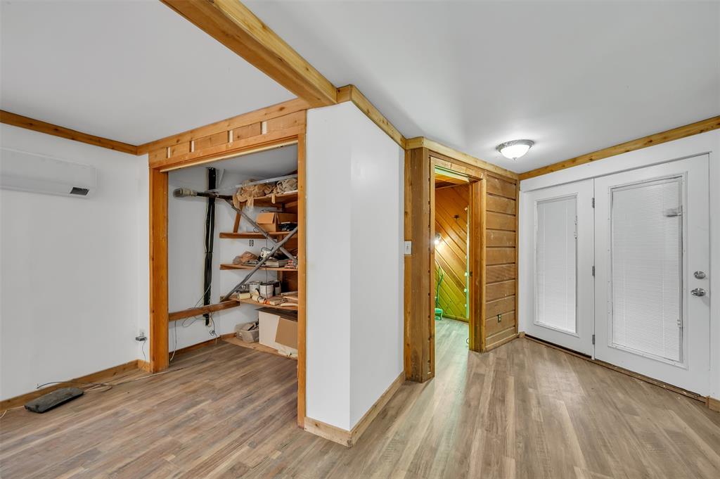 159 Catfish Trail Whitney, TX 76692 - Photo 10 of 36 a view of a hallway with wooden floor and dining room
