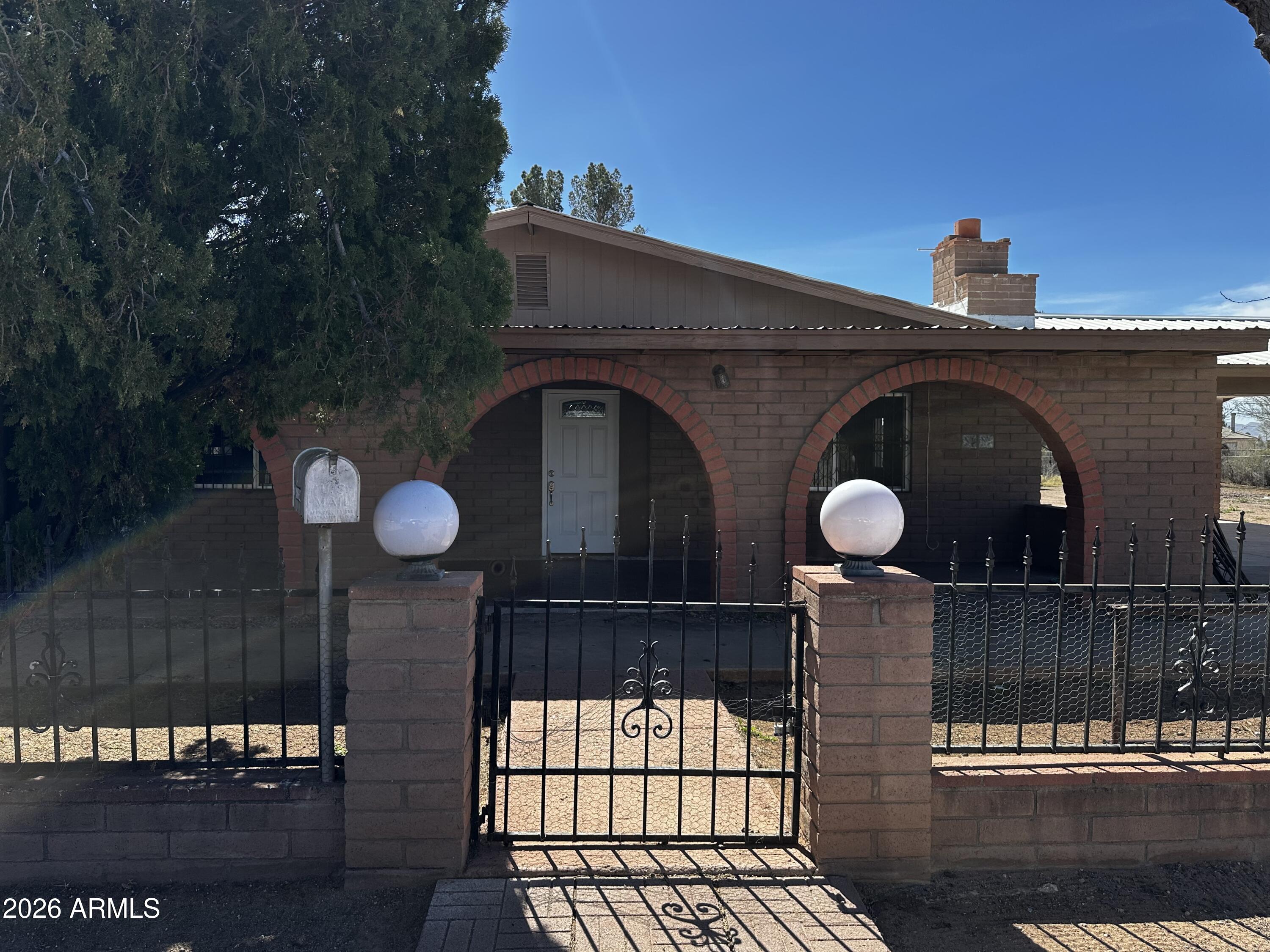 217 East 21st Street Douglas, AZ 85607 - Photo 1 of 22 a view of a wooden door and a street view