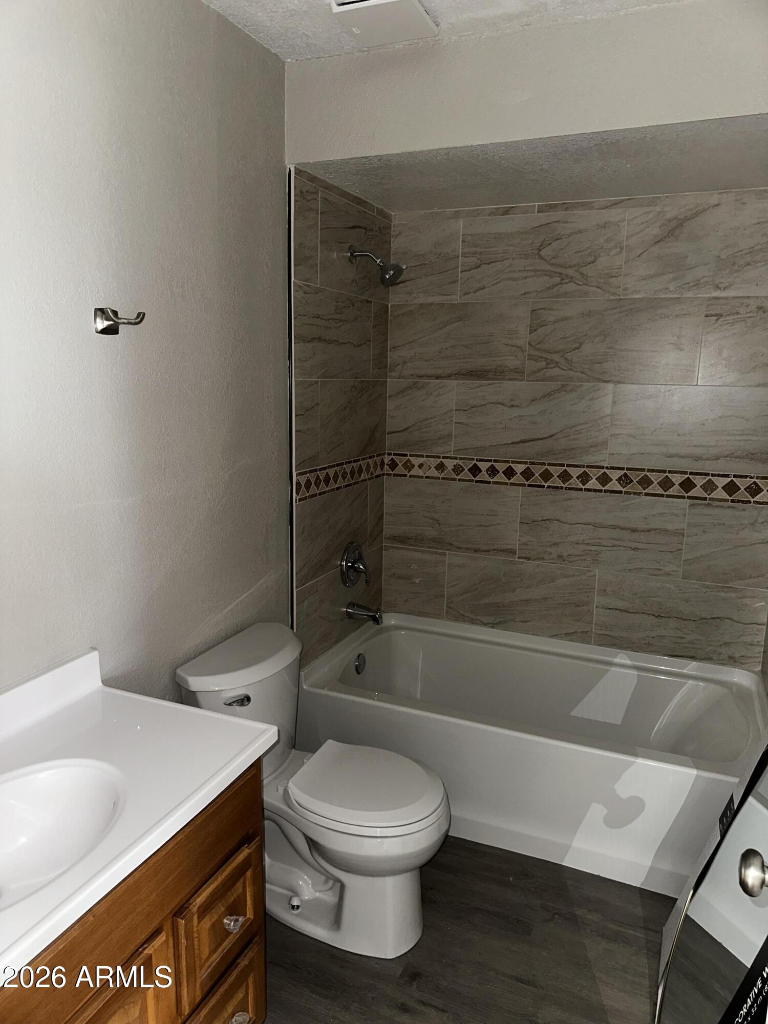 217 East 21st Street Douglas, AZ 85607 - Photo 15 of 23 a bathroom with a sink a toilet and shower