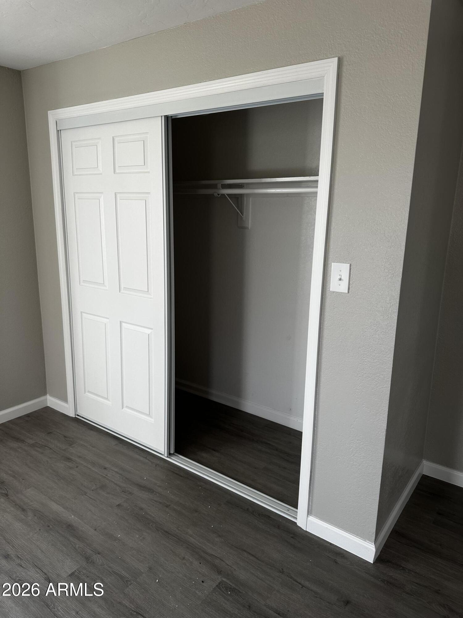 217 East 21st Street Douglas, AZ 85607 - Photo 16 of 23 an empty room with wooden floor and closet