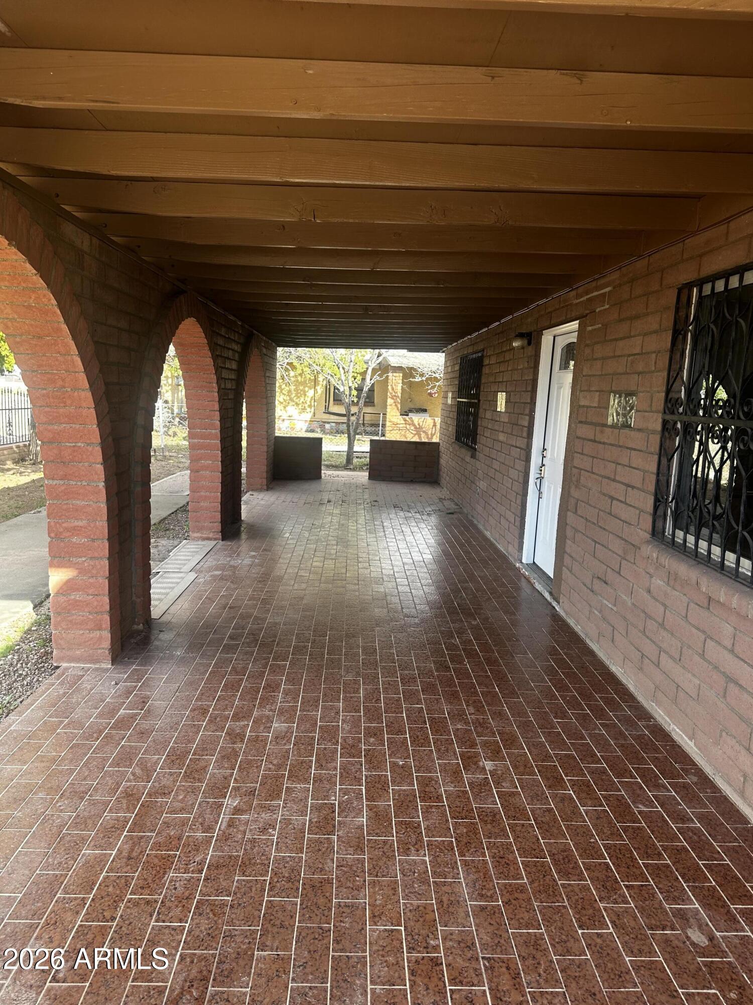 217 East 21st Street Douglas, AZ 85607 - Photo 3 of 22 a view of empty room with wooden floor