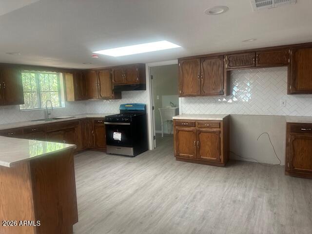 217 East 21st Street Douglas, AZ 85607 - Photo 4 of 23 a kitchen with stainless steel appliances granite countertop a stove a sink and a refrigerator