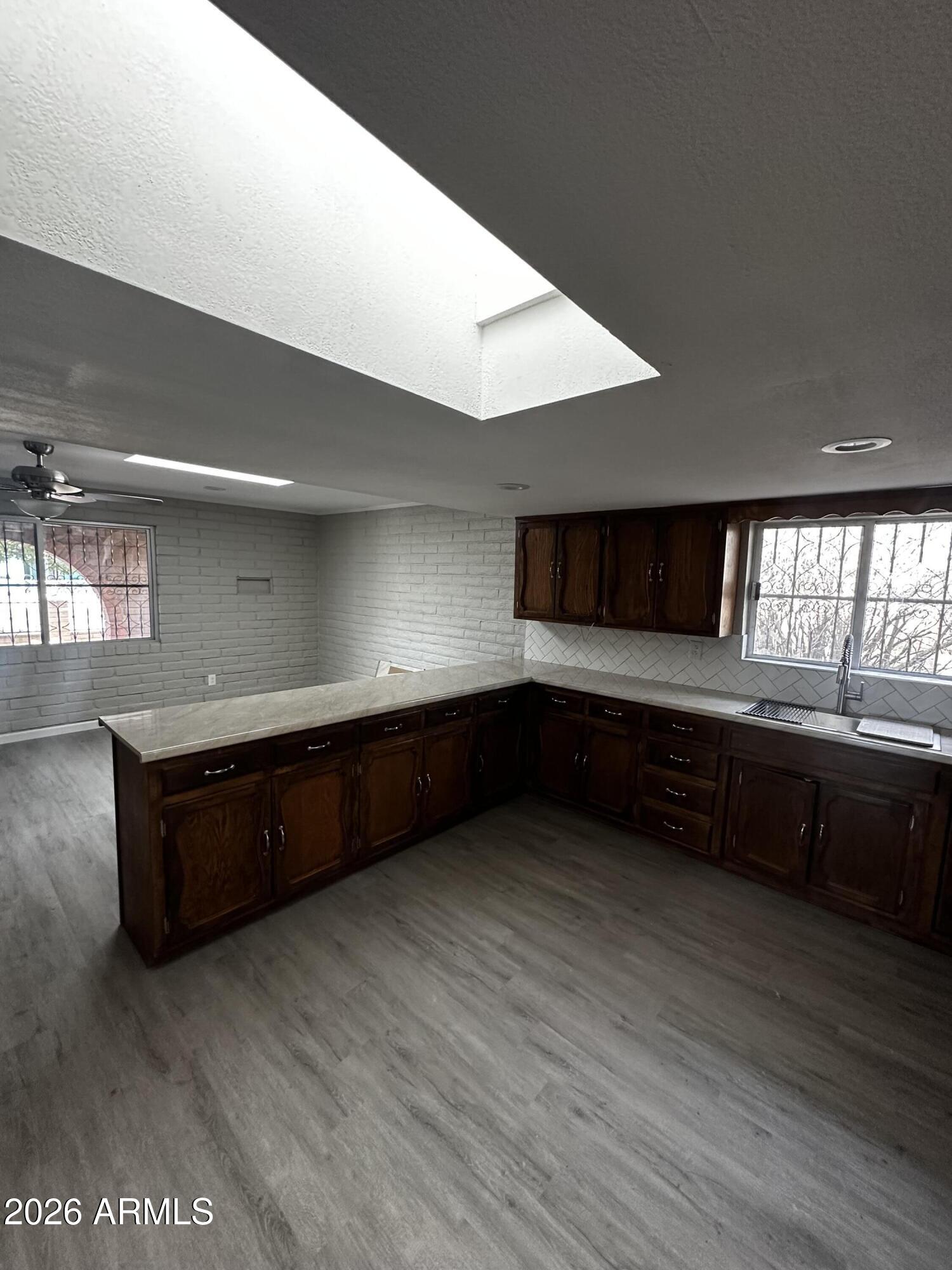 217 East 21st Street Douglas, AZ 85607 - Photo 6 of 22 a living room with hard wood floors and furniture