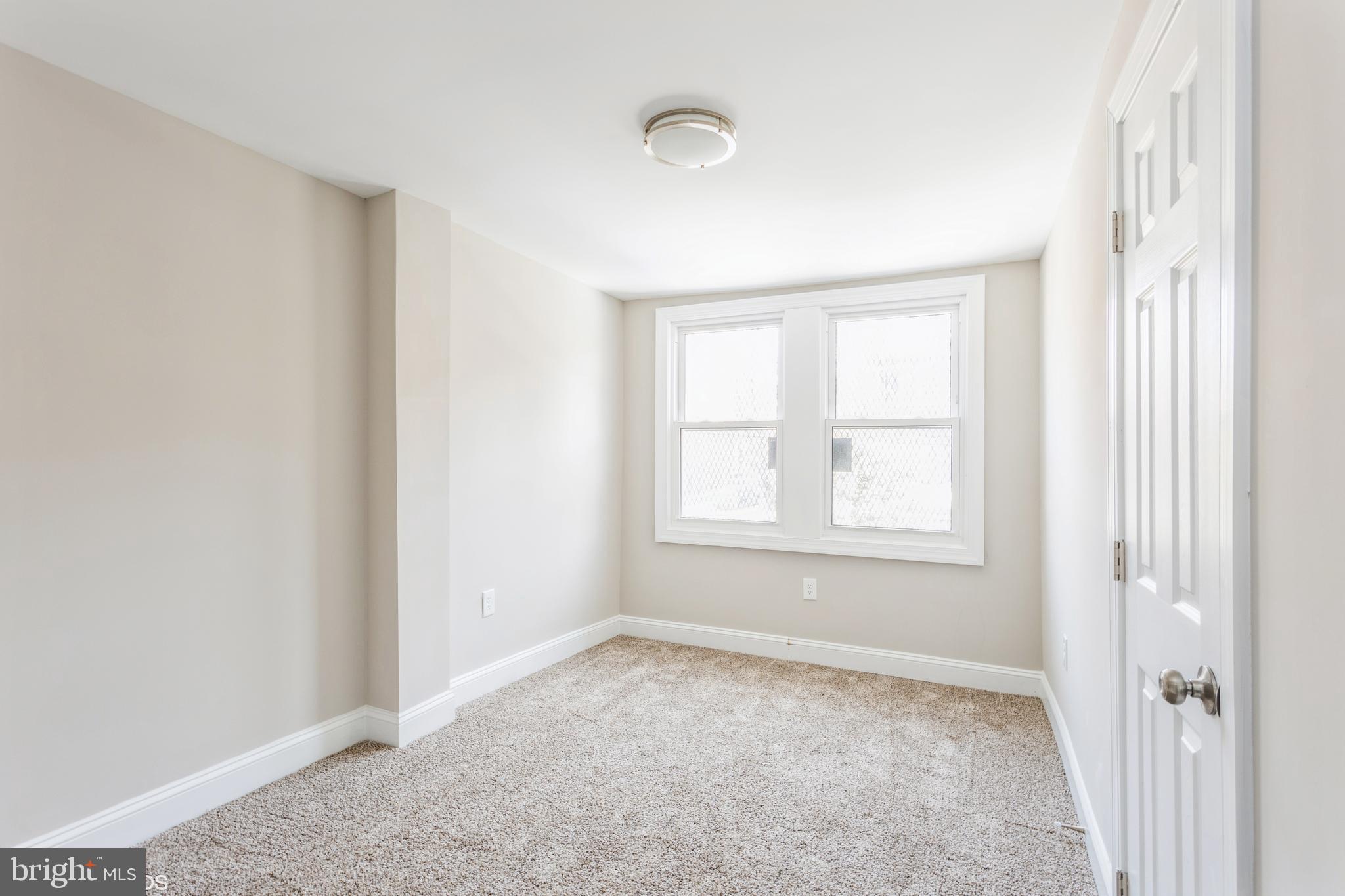 2453 McCulloh Street Baltimore, MD 21217 - Photo 16 of 20 an empty room with a window
