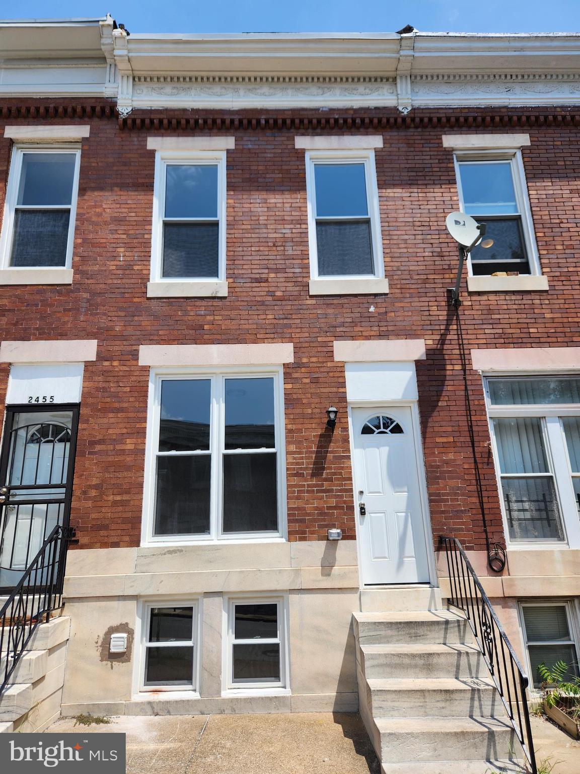 2453 McCulloh Street Baltimore, MD 21217 - Photo 2 of 20 a building with a window and balcony