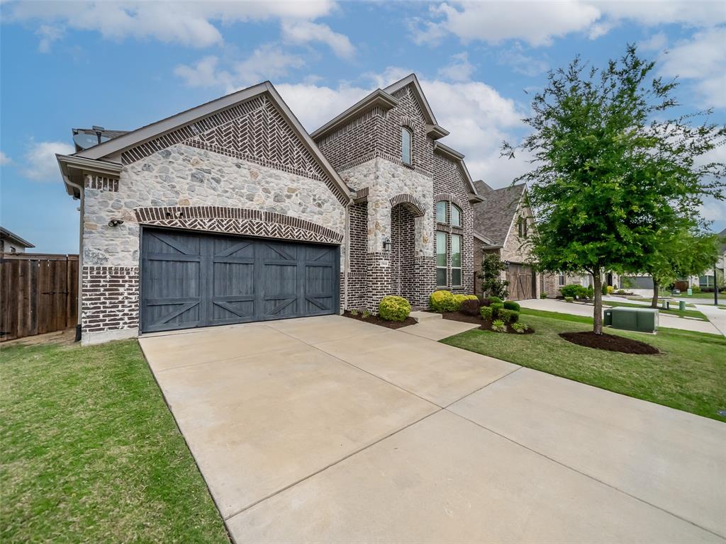 3044 Bold Ruler Road Celina, TX 75009 - Photo 2 of 36 a front view of a house with a yard and garage