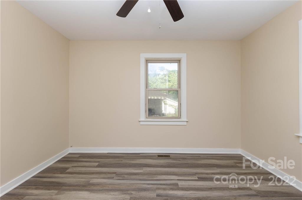 304 West Poplar Street Stanley, NC 28164 - Photo 11 of 21 an empty room with closet and window