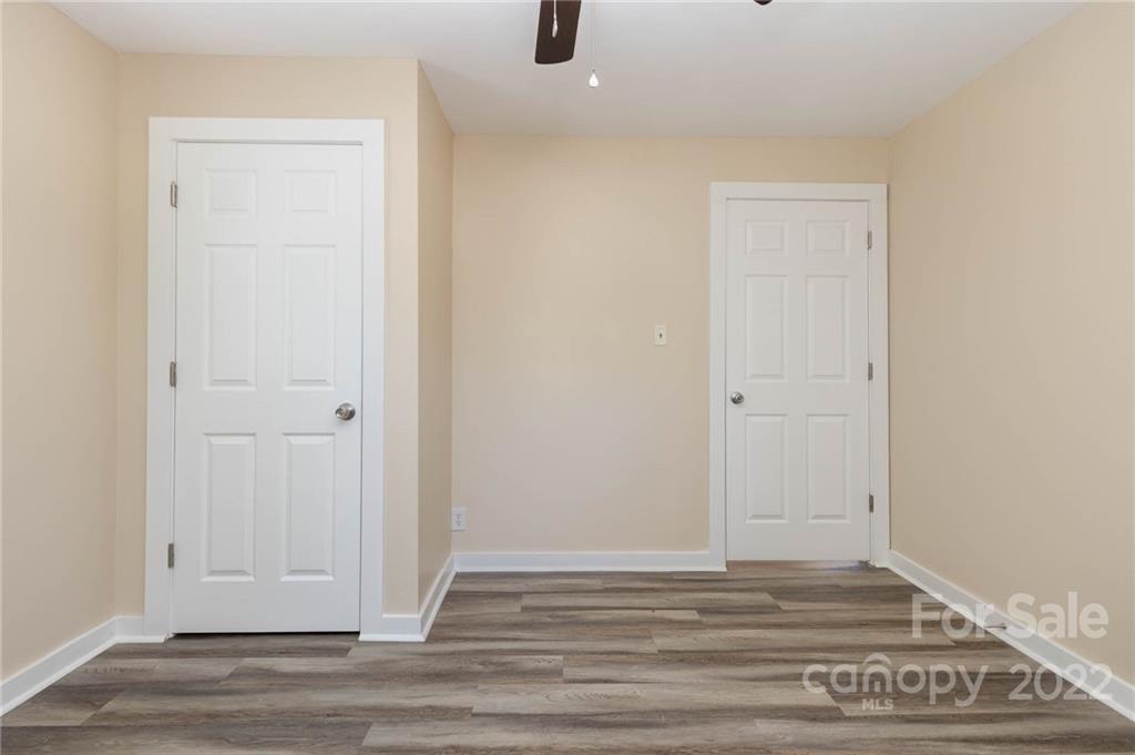 304 West Poplar Street Stanley, NC 28164 - Photo 17 of 21 a view of empty room with wooden floor