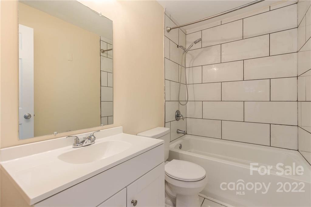 304 West Poplar Street Stanley, NC 28164 - Photo 19 of 21 a bathroom with a sink toilet and shower