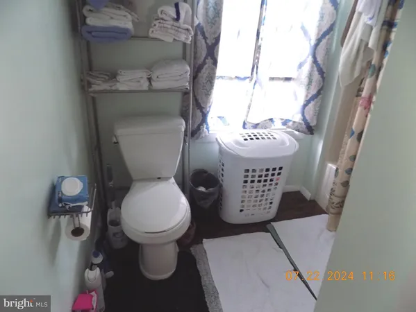 a bathroom with a toilet and a sink