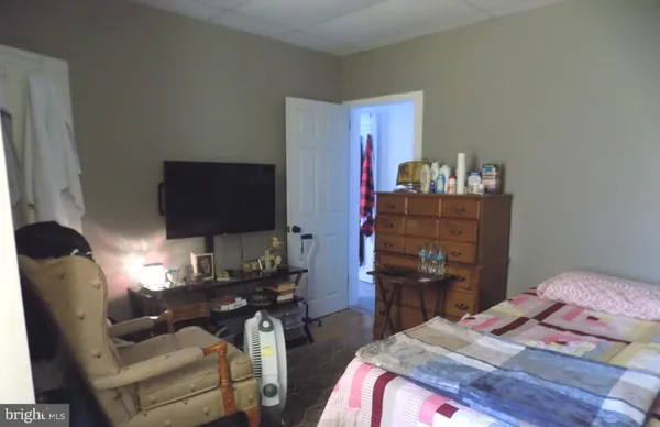 a bedroom with a bed and furniture