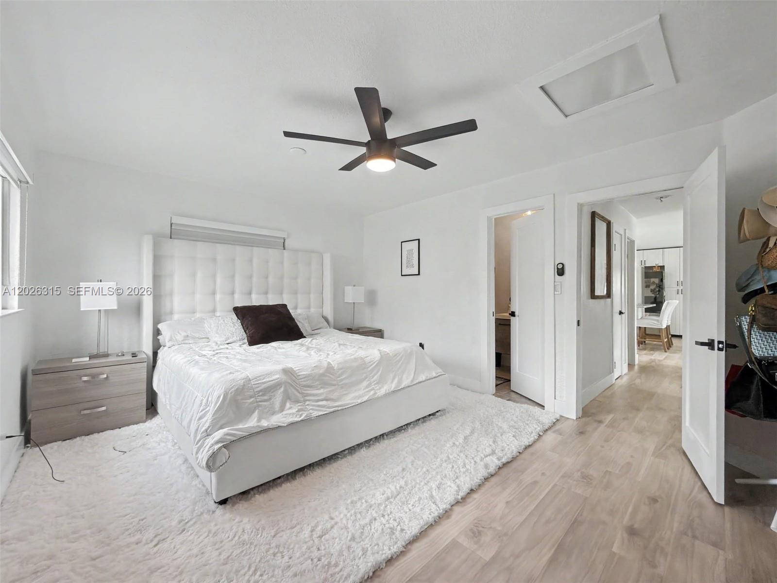 10762 Southwest 145th Street Miami, FL 33176 - Photo 17 of 28 a bedroom with a bed and a flat screen tv