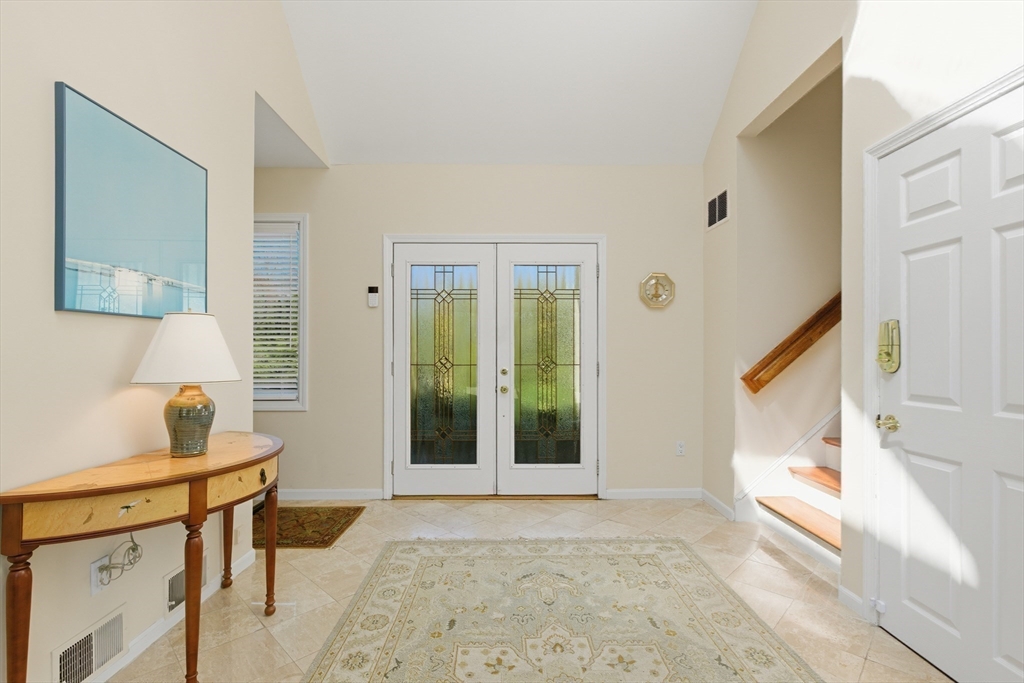 641 Salem End Road Framingham, MA 01702 - Photo 11 of 42 a view of a hallway with furniture and a window