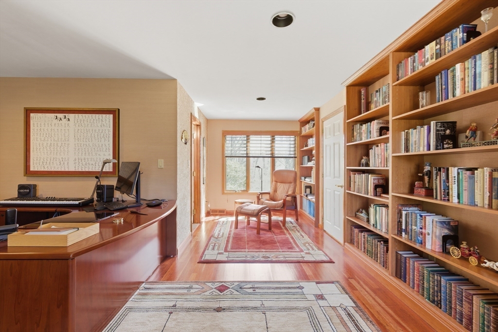 641 Salem End Road Framingham, MA 01702 - Photo 16 of 42 a reading room with furniture book shelf and a rug