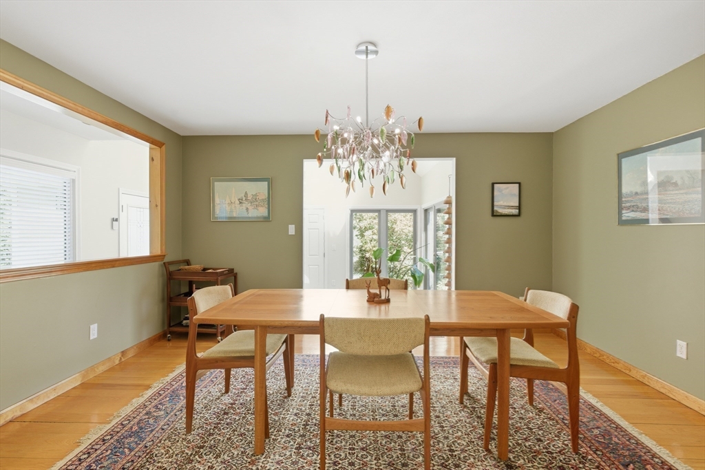 641 Salem End Road Framingham, MA 01702 - Photo 21 of 42 a view of a dining room with furniture and chandelier